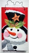 Painting of snowman on wood board