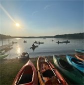 Kayaks stage on the shore