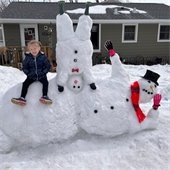 Upside down snowman and child