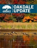 Front page of newsletter with kids and decorated pumpkins