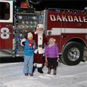 Santa with a festive fire truck