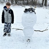 Upside down snowman and child