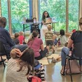 Librarian reads to kids
