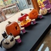 Pumpkin carvings displayed on a table