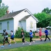 5k racers pass schoolhouse