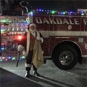 Santa with a festive fire truck