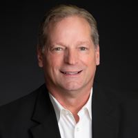 Headshot of person on black background