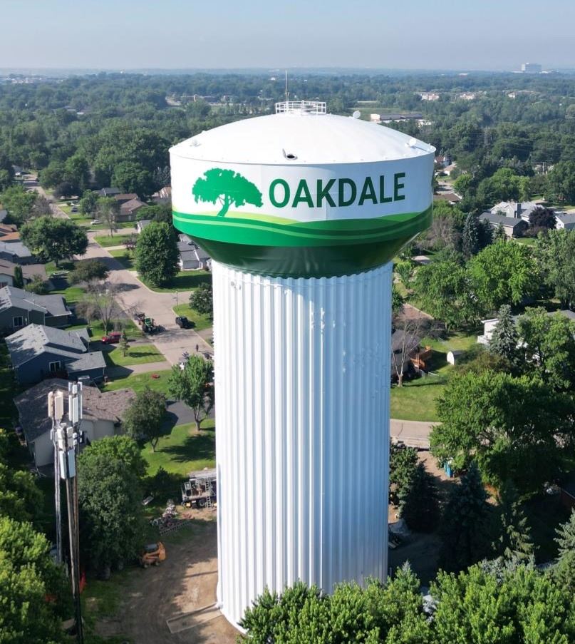 white water tower with green part on bottom and tree logo and text that reads \"OAKDALE\"